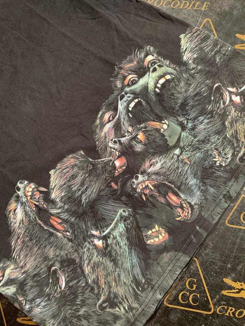 Givenchy Paris Graphic T-shirt (Category: Tshirts & Polo Shirts ) located in Baguio. Submitted by brix6699 (Listing ID 1435590332, Image 2). Description: - Black Givenchy T-shirt - Features a graphic print of snarling animals - Crew neck - Short sleeves - Givenchy Paris label visible - Tag partially detached -Size Xl -Color rate 7/10 - Dimensions Length 28 inches Width 22.5 inches.