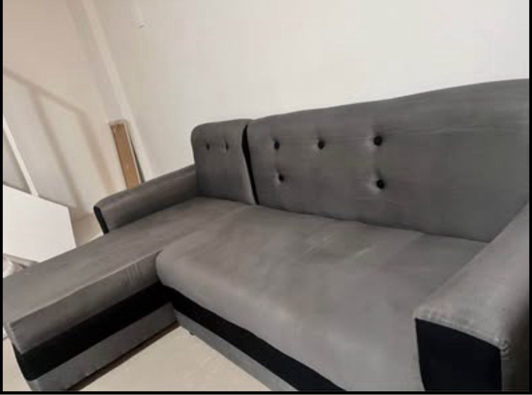 Gray L-Shape Sofa (Category: Sofas) located in Cainta. Submitted by sereia_fins (Listing ID 1435626909, Image 1). Description: Selling our well-loved L-shape sofa with separate ottoman 🛋️ Perfect for condos, apartments, or small living spaces! ✔️ URATEX foam – high quality, firm, and hindi lumulundo ✔️ Newly dry cleaned – fresh and ready to use ✔️ L-shape design (can switch sides depending on your layout) ✔️ Comes with a movable ottoman/footrest