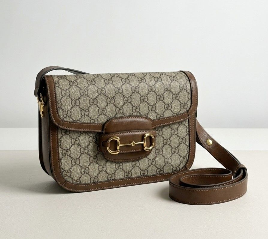 Gucci Horsebit 1955 Shoulder Bag (Category: Luxury Bags & Wallets) located in Naic. Submitted by theprelovedbagstudio (Listing ID 1435700686, Image 1). Description: Gucci 1955 Horsebit Shoulder Bag - Beige/Brown GG Supreme canvas, leather trim, gold Horsebit - Size: 25×18×8 cm, 45cm adjustable strap - Interior: Zip pocket, microfibre lining, front flap closure - Made in Italy - With minimal signs of use on the hardware - Payment Terms: Payment fi