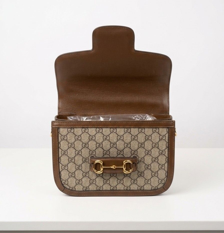 Gucci Horsebit 1955 Shoulder Bag (Category: Luxury Bags & Wallets) located in Naic. Submitted by theprelovedbagstudio (Listing ID 1435700686, Image 2). Description: Gucci 1955 Horsebit Shoulder Bag - Beige/Brown GG Supreme canvas, leather trim, gold Horsebit - Size: 25×18×8 cm, 45cm adjustable strap - Interior: Zip pocket, microfibre lining, front flap closure - Made in Italy - With minimal signs of use on the hardware - Payment Terms: Payment fi