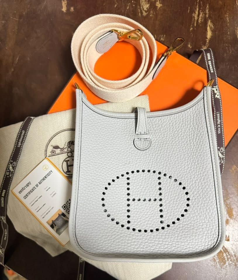 Hermes Evelyne TPM Bag (Category: Luxury Bags & Wallets) located in Quezon City. Submitted by 17brends (Listing ID 1435529234, Image 1). Description: - Authentic Hermes Evelyne TPM bag - Light blue color - Perforated 'H' logo - Includes canvas strap - Comes with dust bag & orange box - Certificate of authenticity included.