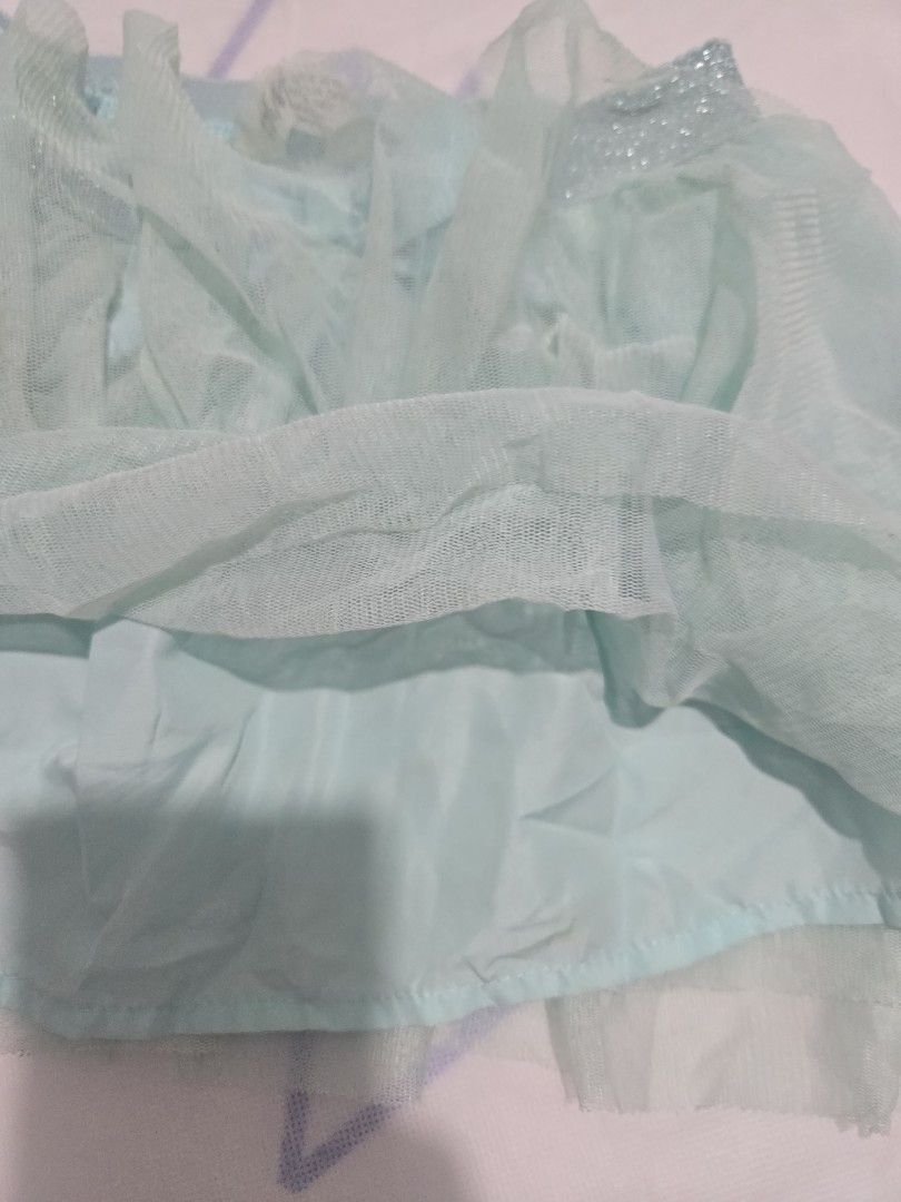 H&M Tulle Skirt with Bow (Category: Babies & Kids Fashion) located in Baliuag. Submitted by chelaz (Listing ID 1435625399, Image 3). Description: - H&M tulle skirt - Soft blue-green color - Delicate bow detail - Sparkly waistband - Multiple layers of tulle - Full, playful look - Comfortable elastic waistband - Great for parties or everyday wear MOP: BPI / Gcash / Maya.