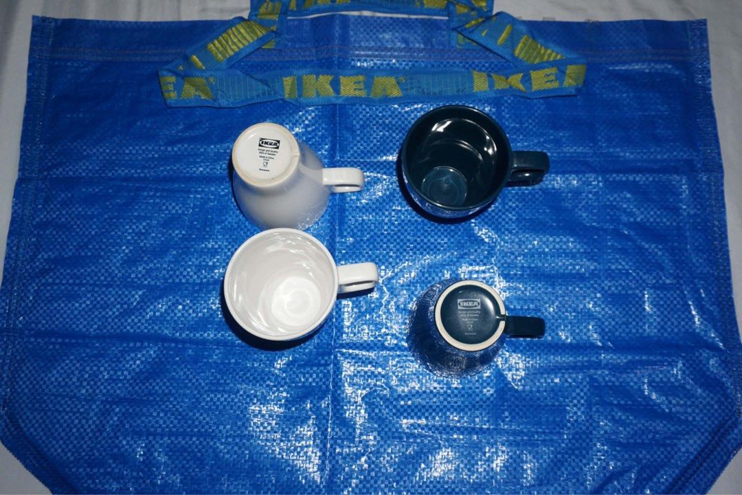 IKEA Mugs with Mug Tree (Category: Coffee & Tea Tableware) located in Antipolo. Submitted by ttrends (Listing ID 1435634446, Image 2). Description: - Includes four IKEA mugs: white and dark blue. - FREE black mug tree with a hexagonal base. - Modern and minimalist design. - Perfect for displaying and organizing your mugs..