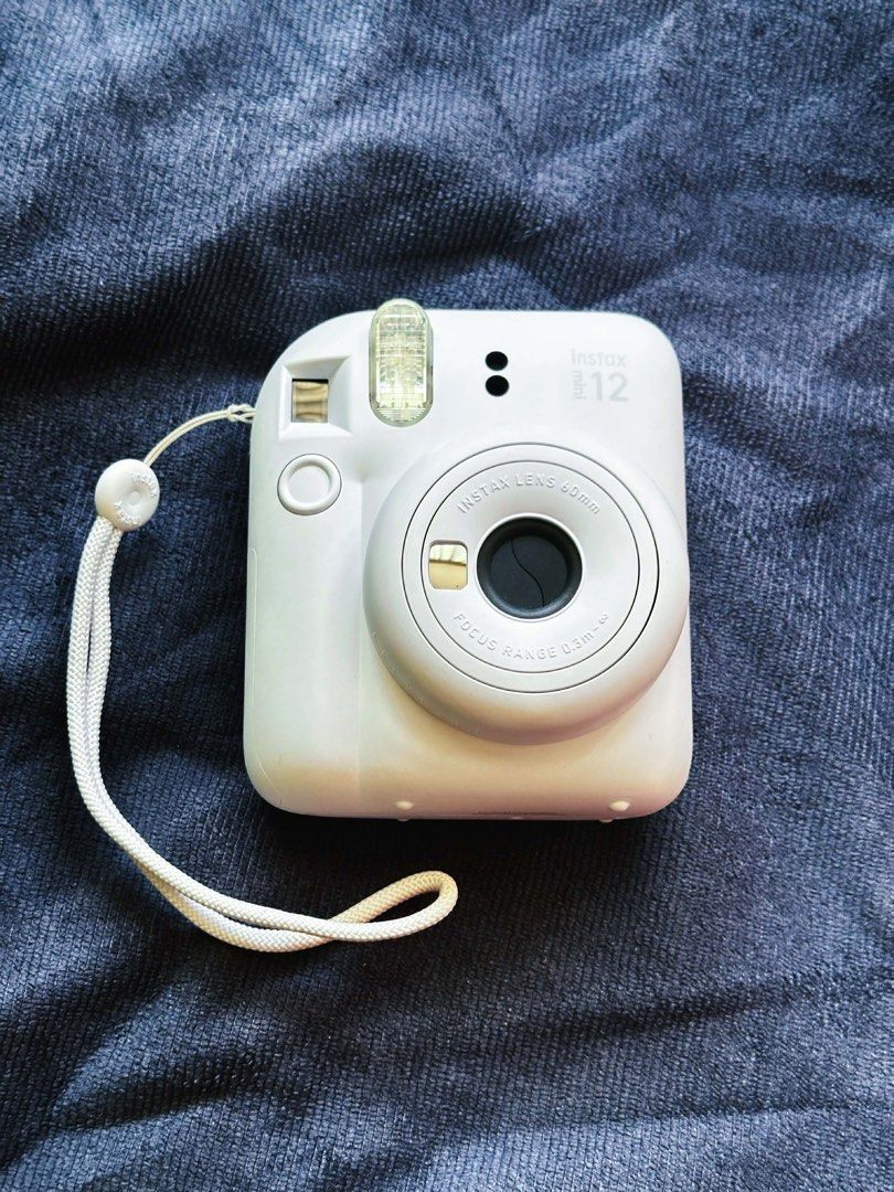 Instax Mini 12 (Category: Cameras) located in Quezon City. Submitted by lonepotato (Listing ID 1435547500, Image 1). Description: Selling as is Requires AA battery and film Used once Rfs: switching to dslr .