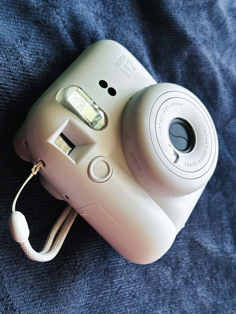 Instax Mini 12 (Category: Cameras) located in Quezon City. Submitted by lonepotato (Listing ID 1435547500, Image 3). Description: Selling as is Requires AA battery and film Used once Rfs: switching to dslr .