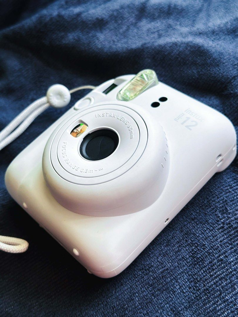 Instax Mini 12 (Category: Cameras) located in Quezon City. Submitted by lonepotato (Listing ID 1435547500, Image 2). Description: Selling as is Requires AA battery and film Used once Rfs: switching to dslr .