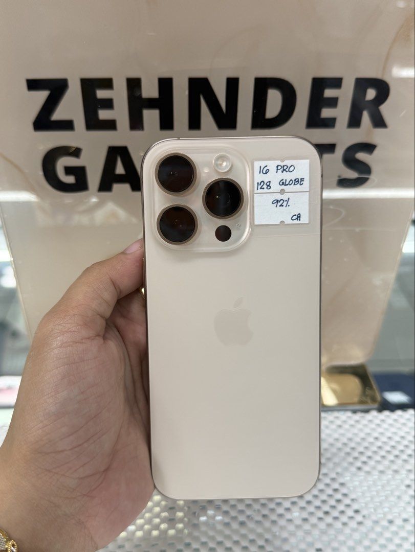 iPhone 16 PRO 128GB GLOBELOCKED (NTC APPROVED) (Category: iPhone 16 Series) located in San Juan City. Submitted by desireebayal96 (Listing ID 1435605963, Image 1). Description: iPhone 16 PRO (DESERT TITANIUM) * NTC APPROVED * GLOBELOCKED (PWEDE IPA OPENLINE) * 128GB * 92% BATTERY HEALTH * 98% SMOOTH * NO ISSUE * NO HISTORY OF REPAIR * NOT REFURBISHED * WORKING FACE ID & TRUETONE * WITH CORD TYPE-C OPEN FOR COD SAME DAY DELIVERY PLUS SHIPPING FEE 