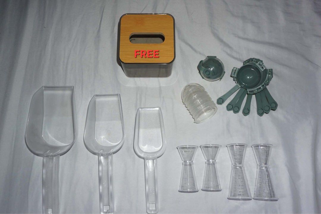 Kitchen Scoops and Measuring Tools Set (Category: Cookware & Accessories) located in Antipolo. Submitted by ttrends (Listing ID 1435635619, Image 1). Description: - Clear plastic scoops in various sizes - Measuring jiggers included - Features a tissue box and other kitchen gadgets - Ideal for measuring ingredients - Great for various kitchen tasks.