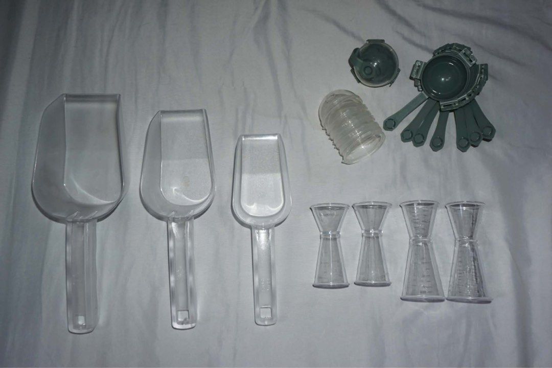 Kitchen Scoops and Measuring Tools Set (Category: Cookware & Accessories) located in Antipolo. Submitted by ttrends (Listing ID 1435635619, Image 2). Description: - Clear plastic scoops in various sizes - Measuring jiggers included - Features a tissue box and other kitchen gadgets - Ideal for measuring ingredients - Great for various kitchen tasks.