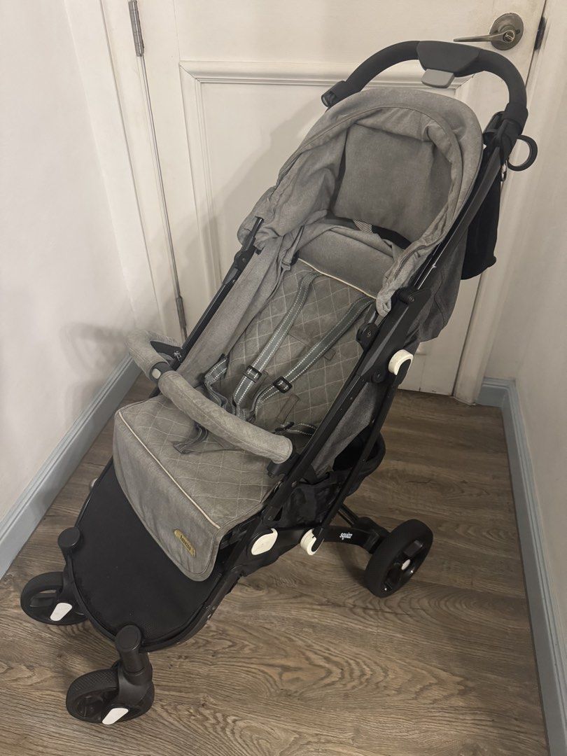 Looping Foldable Stroller - Grey (Category: Strollers) located in Pasig City. Submitted by mp39393 (Listing ID 1435627745, Image 2). Description: - Looping stroller with a stylish grey seat and black frame. - Includes a convenient storage basket and parent organizer. - Folds compactly for easy storage and transport. - Can be stored in the upper bin of an Airplane, doesn’t need to be checked in. - Designed with a comfortable seat and safety harnes