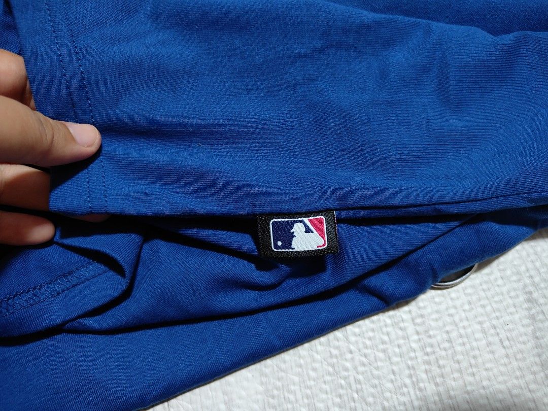Los Angeles Dodgers Baseball Jersey XXL (Category: Tshirts & Polo Shirts ) located in Pandi. Submitted by yanyan_apparel.store08 (Listing ID 1435647708, Image 2). Description: - Official Los Angeles Dodgers Jersey - Size: XXL - Features: Team name and logo on front, LA logo - Color: Blue with white accents - Includes: MLB logo and "Genuine Merchandise" tag.