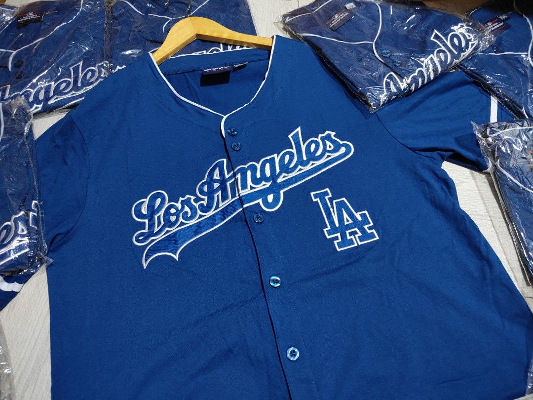 Los Angeles Dodgers Baseball Jersey XXL (Category: Tshirts & Polo Shirts ) located in Pandi. Submitted by yanyan_apparel.store08 (Listing ID 1435647708, Image 1). Description: - Official Los Angeles Dodgers Jersey - Size: XXL - Features: Team name and logo on front, LA logo - Color: Blue with white accents - Includes: MLB logo and "Genuine Merchandise" tag.
