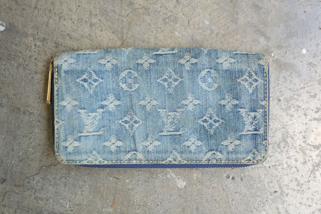 Louis Vuitton - Marc Jacobs - 2007 - Monogram Denim Zippy Wallet (Category: Luxury Bags & Wallets) located in Manila. Submitted by graymatter_ (Listing ID 1435599868, Image 1). Description: Louis Vuitton - Marc Jacobs - 2007 - Monogram Denim Zippy Wallet Condition: Rank A Flaws: Distressing of Denim Body, Light Yellowed Areas, Fading of Gold Plated Hardware and Leather Lining Material: Denim Lining: Leather Made in: Spain SRP: $725 Dimensions Hei