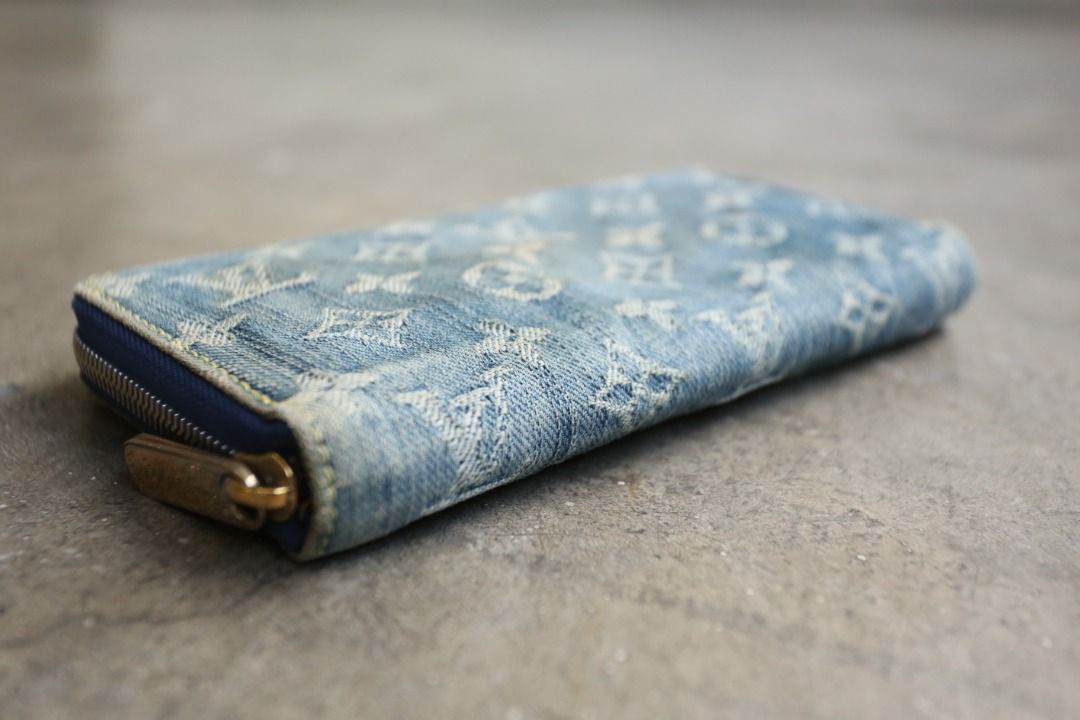 Louis Vuitton - Marc Jacobs - 2007 - Monogram Denim Zippy Wallet (Category: Luxury Bags & Wallets) located in Manila. Submitted by graymatter_ (Listing ID 1435599868, Image 3). Description: Louis Vuitton - Marc Jacobs - 2007 - Monogram Denim Zippy Wallet Condition: Rank A Flaws: Distressing of Denim Body, Light Yellowed Areas, Fading of Gold Plated Hardware and Leather Lining Material: Denim Lining: Leather Made in: Spain SRP: $725 Dimensions Hei