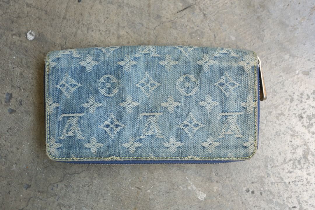 Louis Vuitton - Marc Jacobs - 2007 - Monogram Denim Zippy Wallet (Category: Luxury Bags & Wallets) located in Manila. Submitted by graymatter_ (Listing ID 1435599868, Image 2). Description: Louis Vuitton - Marc Jacobs - 2007 - Monogram Denim Zippy Wallet Condition: Rank A Flaws: Distressing of Denim Body, Light Yellowed Areas, Fading of Gold Plated Hardware and Leather Lining Material: Denim Lining: Leather Made in: Spain SRP: $725 Dimensions Hei