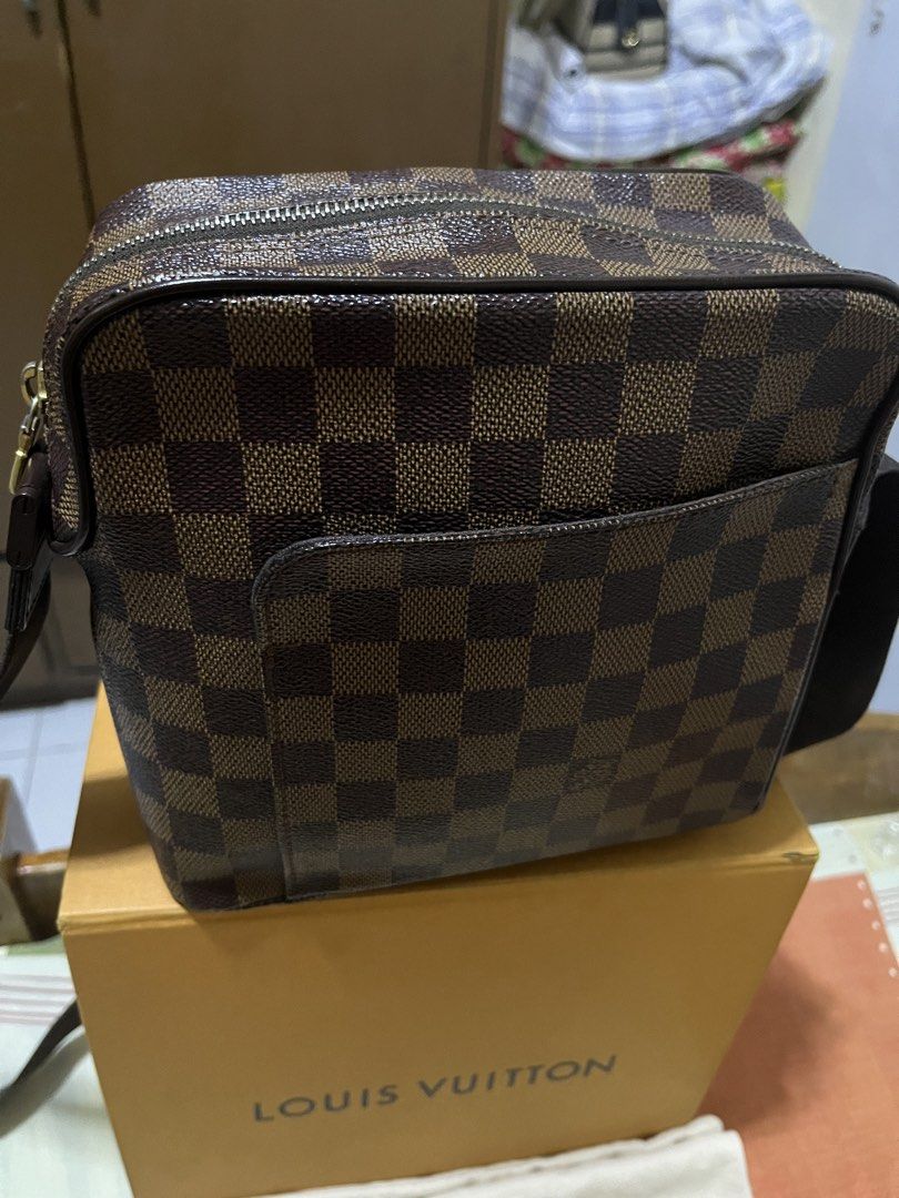 Louis Vuitton Damier OLAV Bag (Category: Luxury Bags & Wallets) located in Manila. Submitted by jankbaiteh05162 (Listing ID 1435604038, Image 2). Description: - Authentic Louis Vuitton Damier Ebene crossbody bag - Classic Damier Ebene checkered pattern - Includes original box and dust bag - Features a front pocket and zip closure - Adjustable strap.