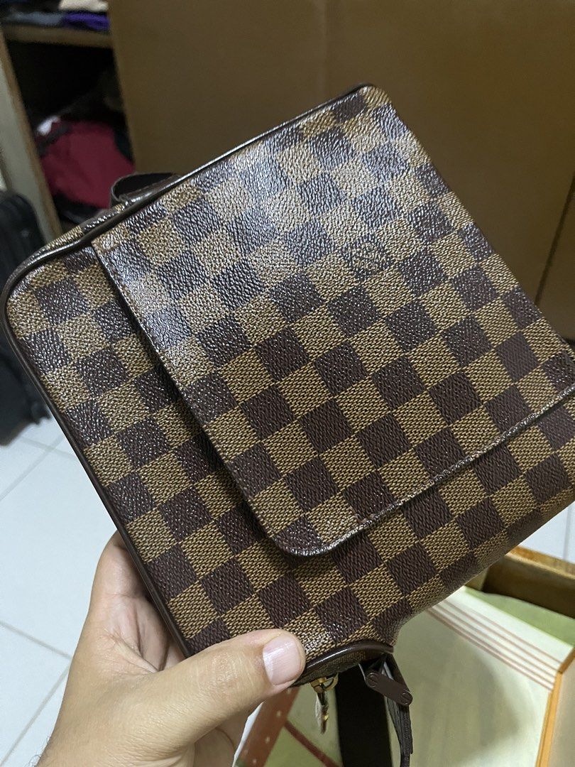 Louis Vuitton Damier OLAV Bag (Category: Luxury Bags & Wallets) located in Manila. Submitted by jankbaiteh05162 (Listing ID 1435604038, Image 3). Description: - Authentic Louis Vuitton Damier Ebene crossbody bag - Classic Damier Ebene checkered pattern - Includes original box and dust bag - Features a front pocket and zip closure - Adjustable strap.