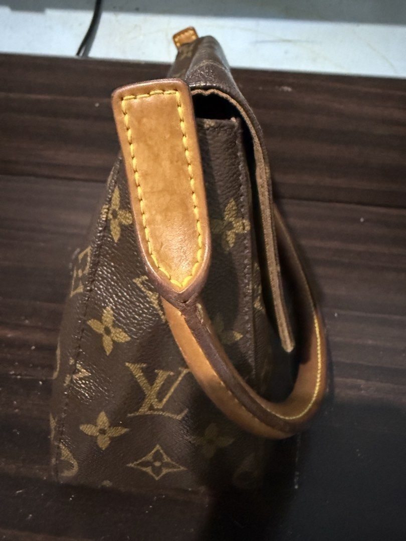 Louis Vuitton Monogram Shoulder Bag (Category: Luxury Bags & Wallets) located in Iloilo. Submitted by kristena87 (Listing ID 1435618044, Image 3). Description: - Authentic Louis Vuitton shoulder bag - Classic Monogram canvas - Flap closure - Single handle - Interior zippered pocket - Leather handle with yellow stitching - Iconic LV monogram pattern.
