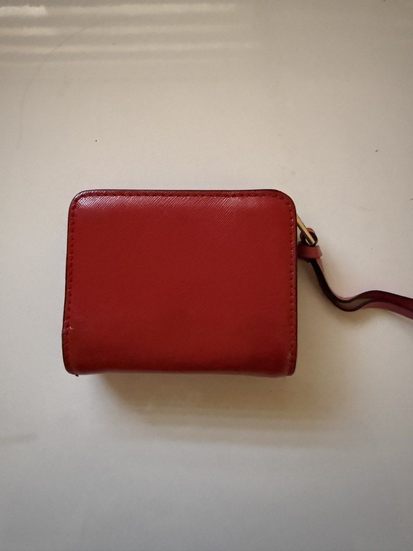 Marc Jacobs Snapshot Compact Wallet (Category: Luxury Bags & Wallets) located in Las Pinas. Submitted by bienmdd (Listing ID 1435571109, Image 3). Description: - Authentic Marc Jacobs wallet - Vibrant pink color - Gold-tone logo - Multiple card slots - Secure snap closure - Includes wrist strap - Pink interior with black lining.