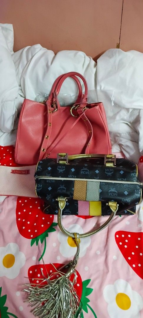 BUNDLE 6 MCM and Pink Handbags (Category: Luxury Bags & Wallets) located in Quezon City. Submitted by 4_leaf_clover (Listing ID 1435568280, Image 1). Description: - Pink handbag with shoulder strap. - Black handbag with gold-colored hardware and tassel. - Features an MCM pattern. SAMANTHA THAVASA + MCM JAPAN BALE.