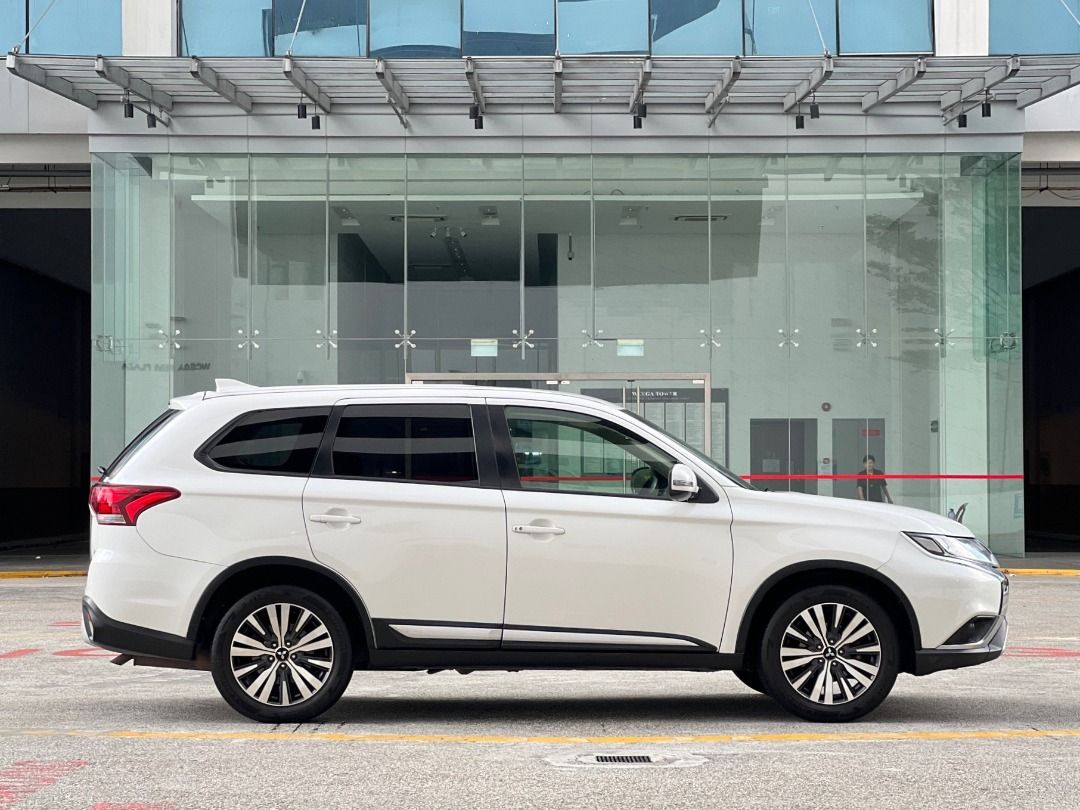 Mitsubishi Outlander 2.0 CVT Modern 7-Seater (A) (Category: Used Cars) located in Singapore. Submitted by idealauto (Listing ID 1435601329, Image 3). Description: Vehicle Features Made in japan, 2.0l MIVEC engine, 6 speed CVT, paddle shifter, cruise controls, keyless, 7 airbags, electric tailgate. Accessories Keyless entry and start/stop, Bluetooth, sport rims, fog lamp, headlamp, climatic aircon, reverse sensors, reverse camera. Description 2 ow
