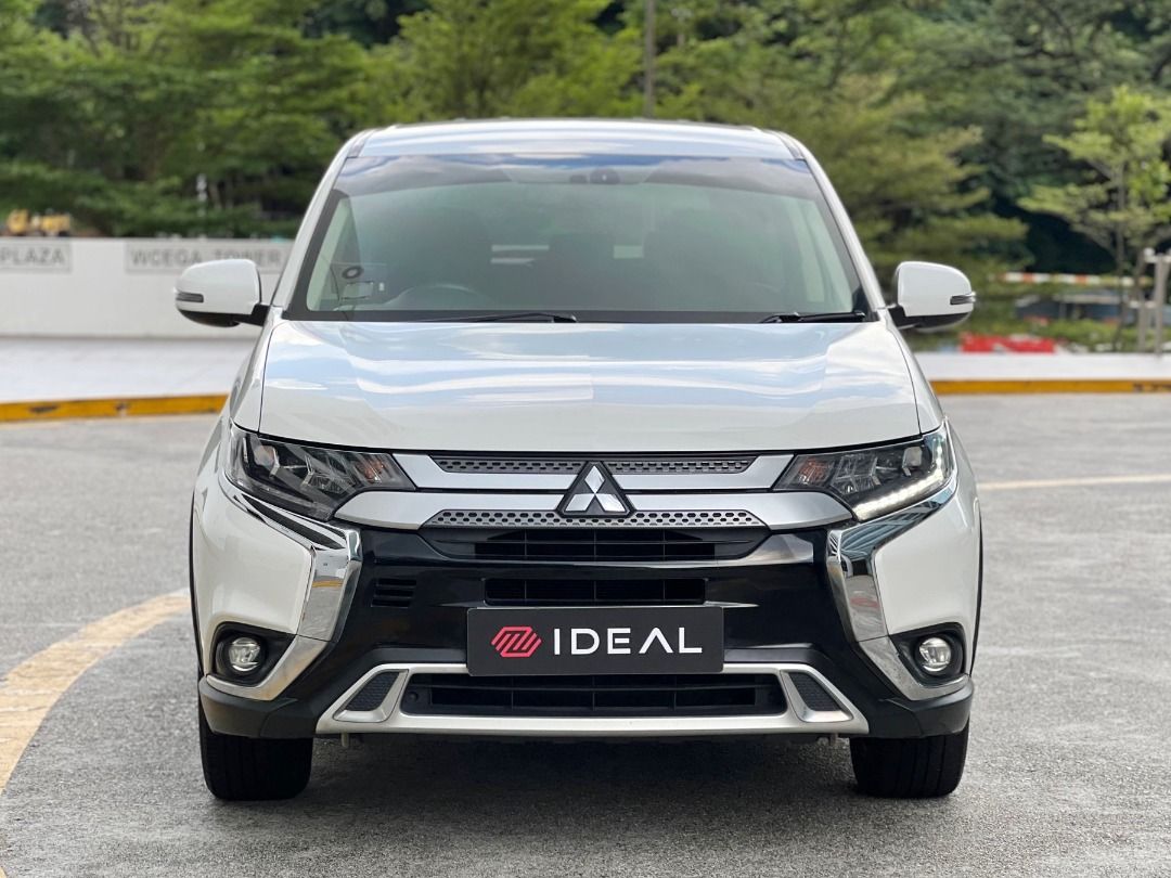 Mitsubishi Outlander 2.0 CVT Modern 7-Seater (A) (Category: Used Cars) located in Singapore. Submitted by idealauto (Listing ID 1435601329, Image 2). Description: Vehicle Features Made in japan, 2.0l MIVEC engine, 6 speed CVT, paddle shifter, cruise controls, keyless, 7 airbags, electric tailgate. Accessories Keyless entry and start/stop, Bluetooth, sport rims, fog lamp, headlamp, climatic aircon, reverse sensors, reverse camera. Description 2 ow