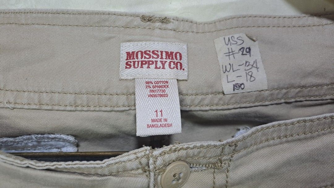 Mossimo Supply Co. Khaki Shorts - Size 11 (Category: Shorts) located in Davao. Submitted by bravemoon_556cd5 (Listing ID 1435525090, Image 3). Description: - Brand: Mossimo Supply Co. - Size: 11 - Waist: 34 - Length: 18 - Material: 98% Cotton, 2% Spandex - Features: Button closure, multiple pockets - Color: Khaki (Neutral) - Made in Bangladesh.