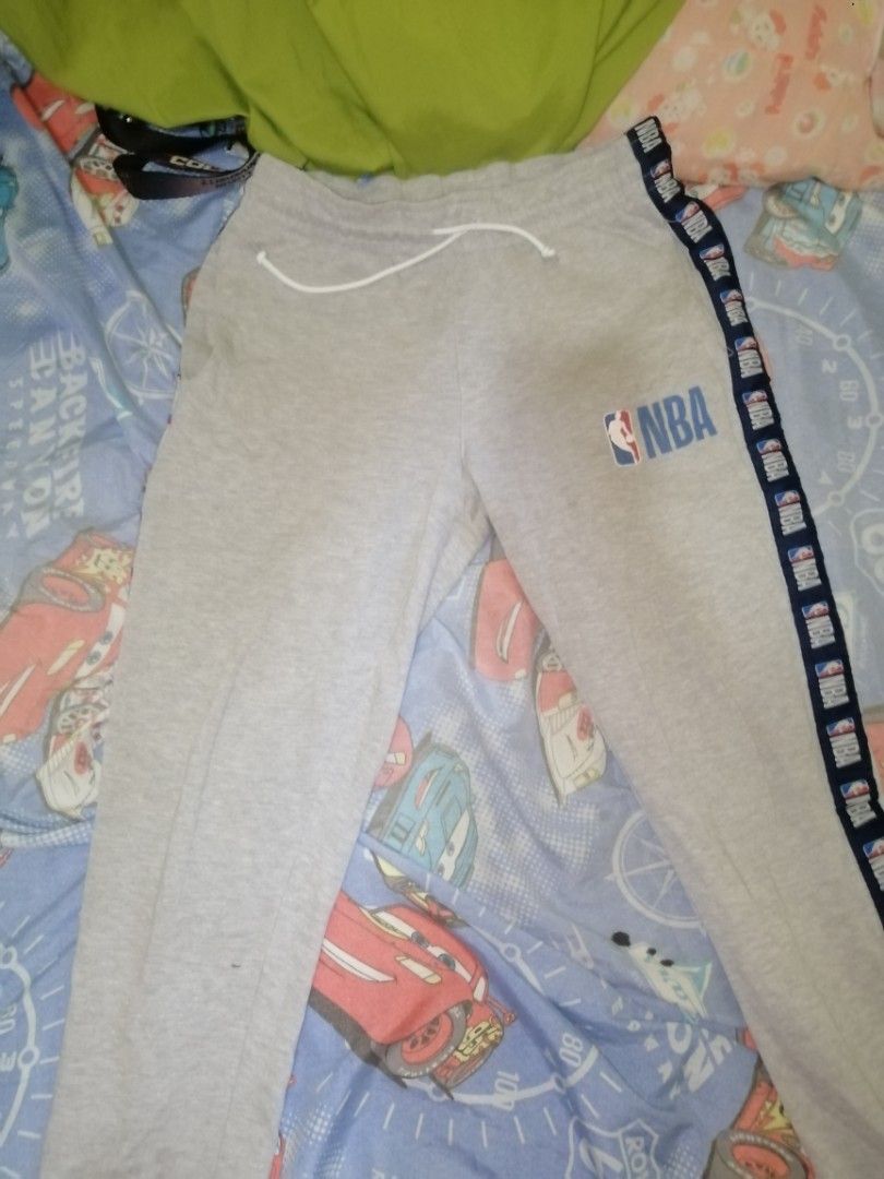 NBA Sweatpants - Medium (Category: Joggers) located in Caloocan City. Submitted by aviannarivera (Listing ID 1435551034, Image 1). Description: - Gray NBA sweatpants - Size: Medium - Features NBA logo - Navy blue stripe detail - Drawstring waist - Made in China.