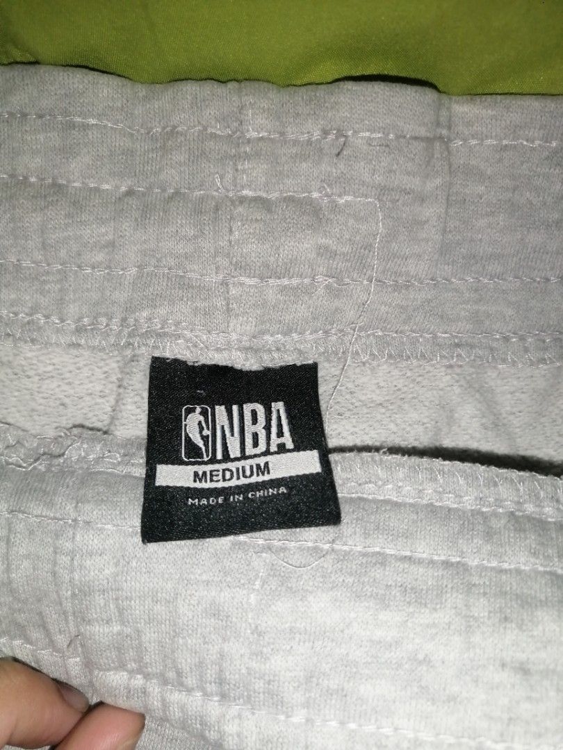 NBA Sweatpants - Medium (Category: Joggers) located in Caloocan City. Submitted by aviannarivera (Listing ID 1435551034, Image 3). Description: - Gray NBA sweatpants - Size: Medium - Features NBA logo - Navy blue stripe detail - Drawstring waist - Made in China.