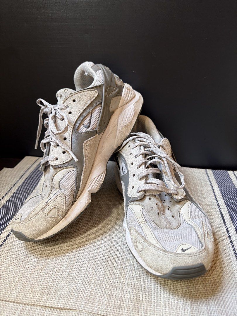 Nike Air Huarache Runner Sneakers (Category: Sneakers) located in Makati City. Submitted by ca.declutter (Listing ID 1435597116, Image 1). Description: - Nike Air Huarache sneakers - Color: Grey and White - Upper: Mesh and suede - Nike logo on side and heel - Air logo visible on heel - Signs of wear on soles - Laces included - Padded collar for comfort.