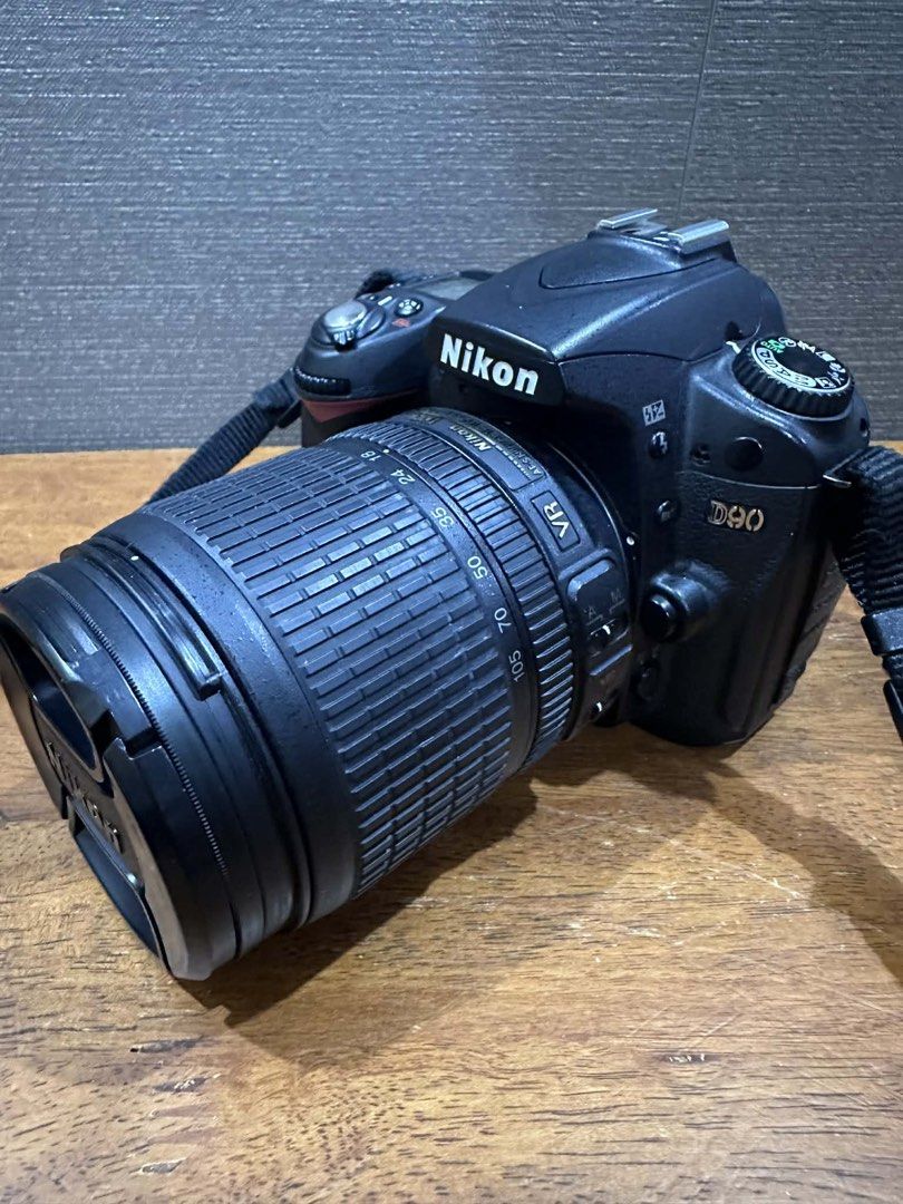 Nikon D90 DSLR Camera with Lens and Speedlight (Category: Cameras) located in Los Banos. Submitted by tripleceedoubletwo (Listing ID 1435711714, Image 3). Description: - Nikon D90 DSLR camera - Includes zoom lens - Speedlight SB-700 included - Comes with lens cap, camera strap, and lens hood - Perfect for photography enthusiasts - Ready to shoot.