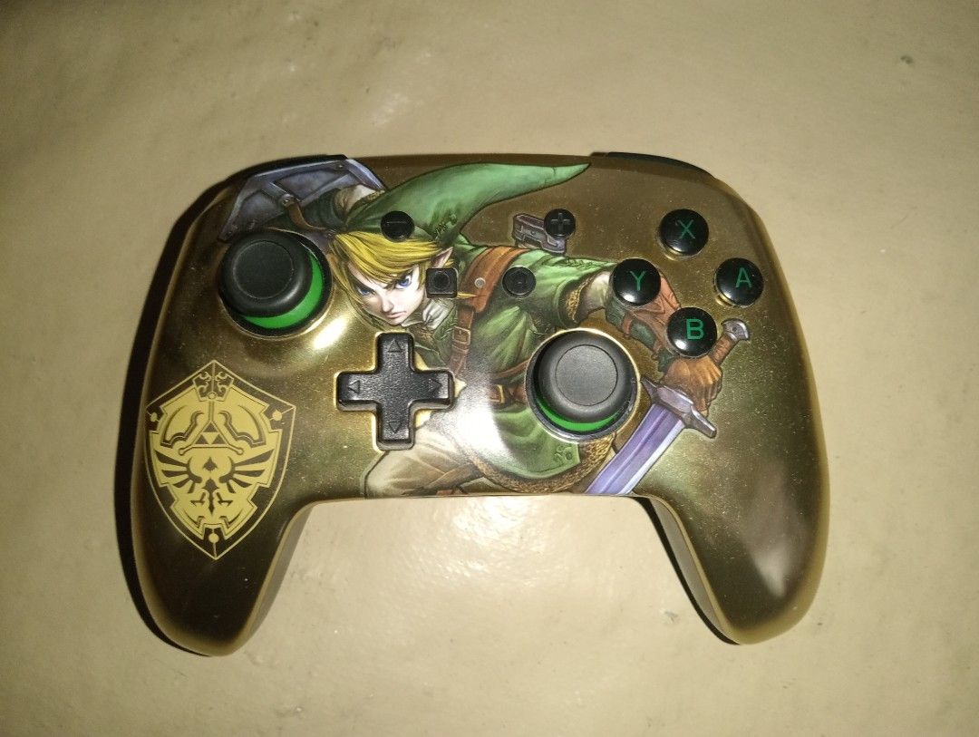 Nintendo Switch Controller - Zelda Edition (Category: Controllers) located in Luna. Submitted by francis_172 (Listing ID 1435662780, Image 1). Description: 🎮 PowerA Enhanced Wireless Controller for Nintendo Switch – Zelda Edition ✅ Fully working ✅ No stick drift ✅ Buttons responsive ✅ Good condition ✅ Wireless connection smooth Legend of Zelda design / collectible look. Perfect extra controller for Nintendo Switch gaming. 📦 No box 💰 Price: ₱20