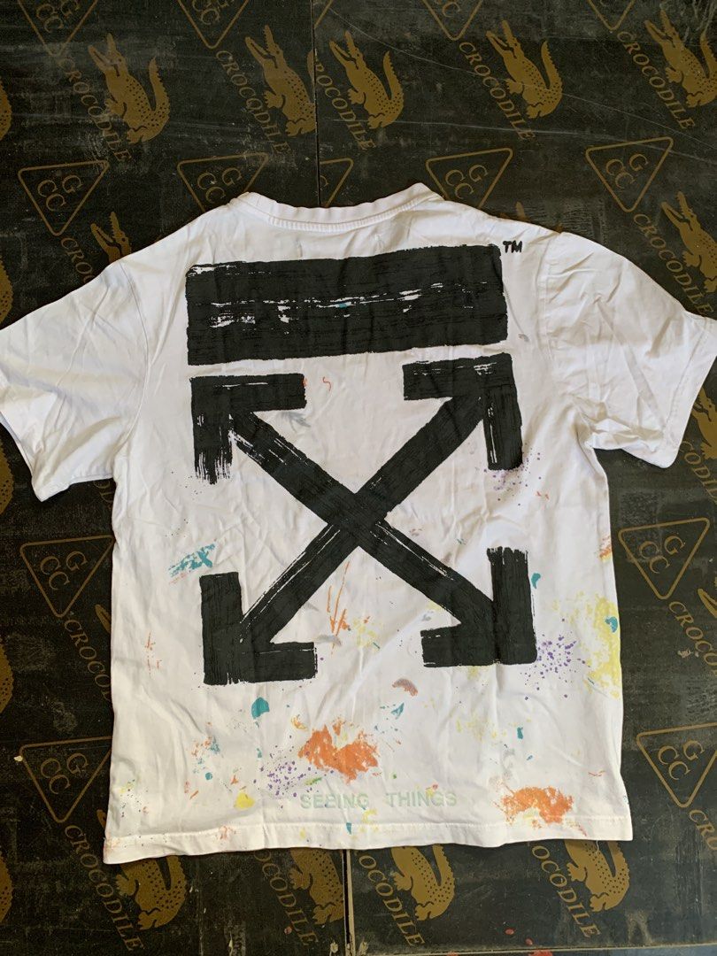Off-White Paint Splatter T-shirt XS (Category: Tshirts & Polo Shirts ) located in Baguio. Submitted by brix6699 (Listing ID 1435606827, Image 2). Description: - Off-White T-shirt with paint splatter design - Features the iconic arrow logo on the back - "OFF" print on the front - Crew neck and short sleeves - Made from 100% cotton - Size: XS -no issues - Dimensions Length 25.5 inches Width 19.5 inches.