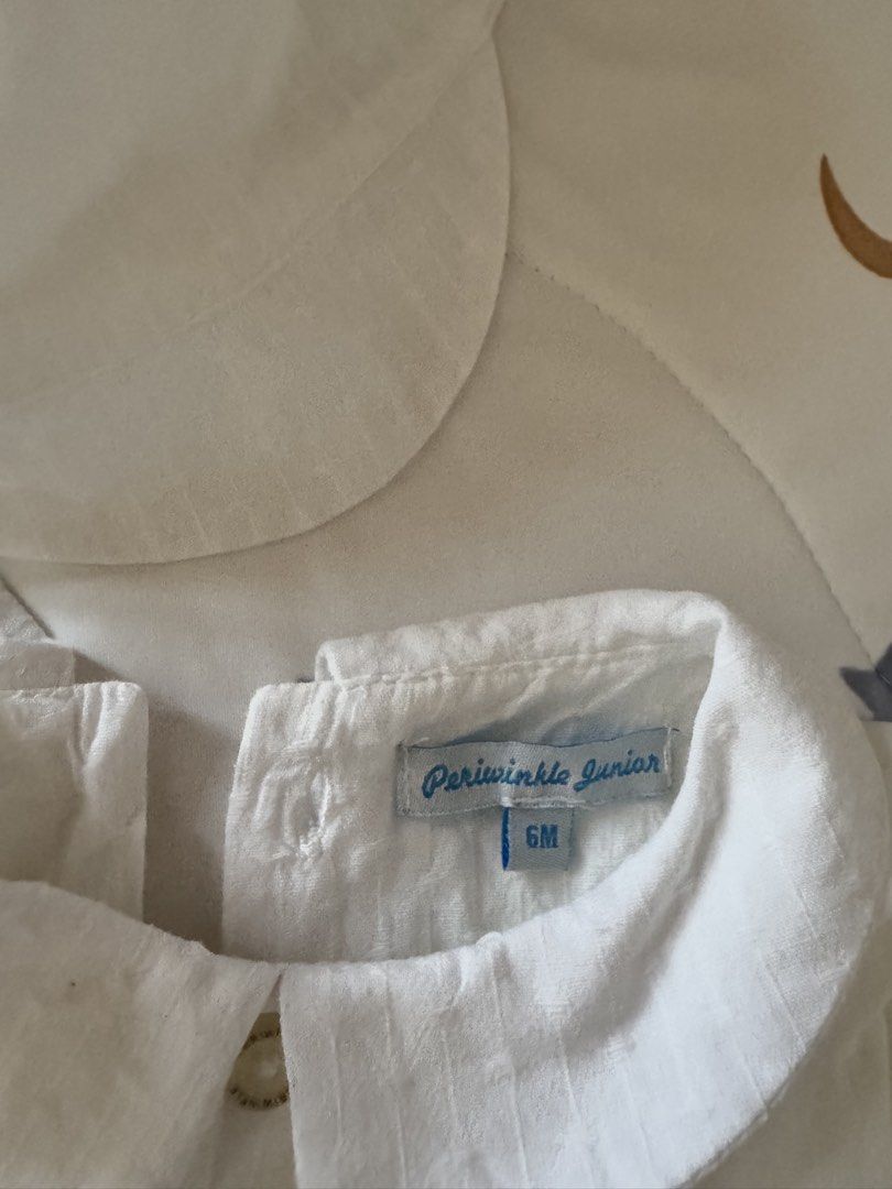 Periwinle Junior Baby Romper with Hat - 6M (Category: Babies & Kids Fashion) located in Manila. Submitted by tallyava (Listing ID 1435544767, Image 3). Description: - Periwinle Junior white baby romper set - Designed for 6-month-old babies - Includes romper and matching hat - Romper features: - Classic collar - Button details - Short sleeves - Textured fabric - Comfortable fit - Suitable for special occasions or everyday use.