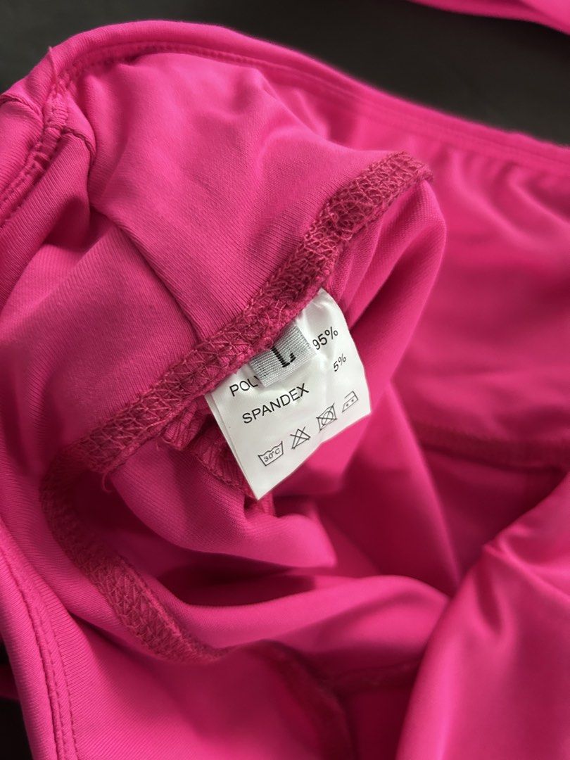 Pink Halter Top and Shorts Set (Category: Activewear) located in Antipolo. Submitted by cl026 (Listing ID 1435592047, Image 3). Description: Activewear set includes a halter top and matching shorts. The set is a vibrant pink color. The shorts have ruched detailing and adjustable ties. The fabric composition is 95% polyester and 5% spandex. The size is Large..