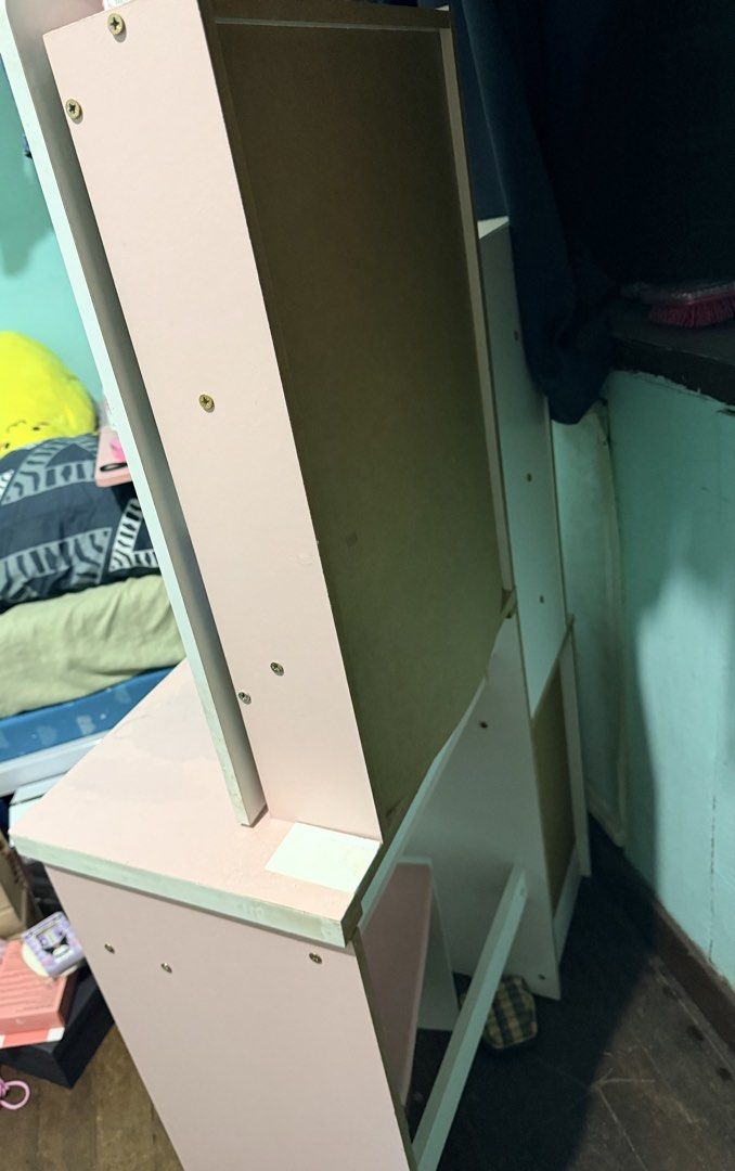 Pink Vanity Table with Mirror and Stool - Assembled (Category: Tables & Sets) located in Quezon City. Submitted by velleshop (Listing ID 1431587609, Image 2). Description: Already Assembled! - Pink vanity table with mirror - Includes matching stool with pink cushioned seat - Features multiple drawers with wooden handles - One drawer with key lock for security - Built-in side shelf unit - Mirror framed in pink.