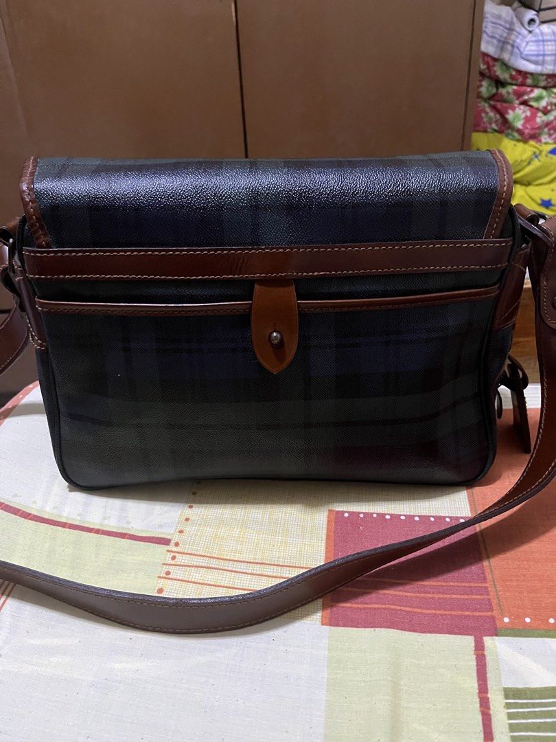 Polo Ralph Lauren Plaid Messenger Bag (Category: Luxury Bags & Wallets) located in Manila. Submitted by jankbaiteh05162 (Listing ID 1435604525, Image 2). Description: - Polo Ralph Lauren messenger bag - Plaid pattern - Flap closure with buckle straps - Brown leather shoulder strap and accents - Small logo tag Look new looks elegant.