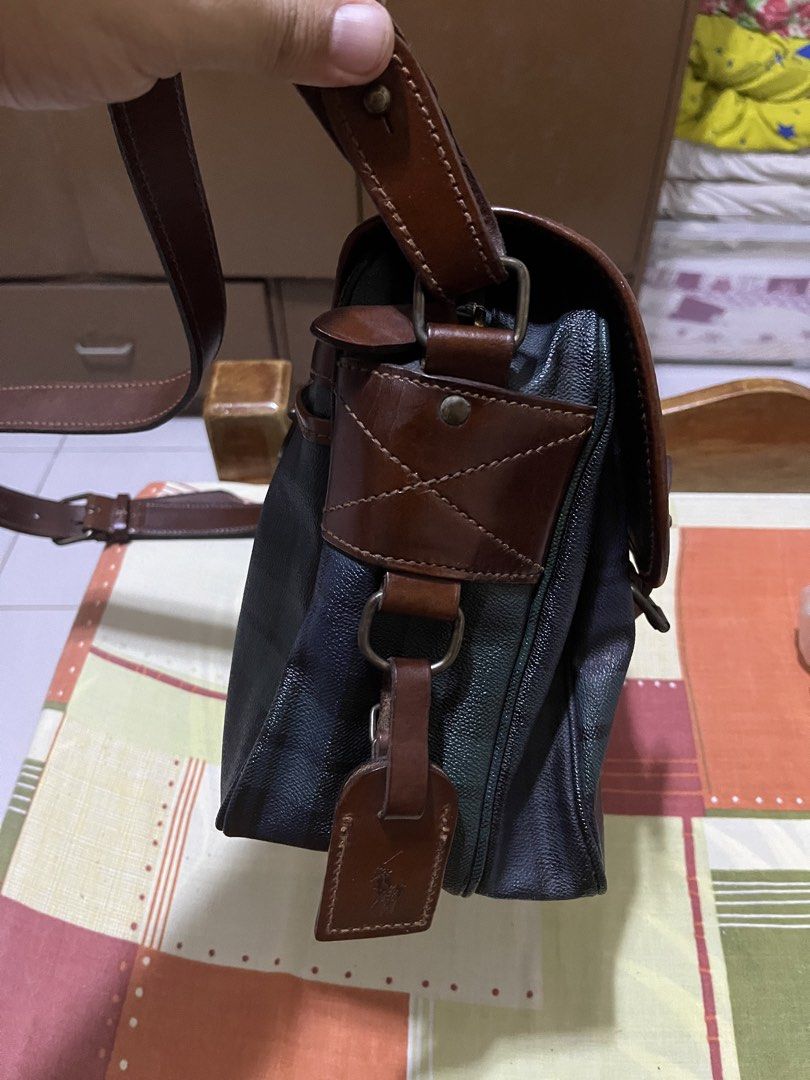 Polo Ralph Lauren Plaid Messenger Bag (Category: Luxury Bags & Wallets) located in Manila. Submitted by jankbaiteh05162 (Listing ID 1435604525, Image 3). Description: - Polo Ralph Lauren messenger bag - Plaid pattern - Flap closure with buckle straps - Brown leather shoulder strap and accents - Small logo tag Look new looks elegant.