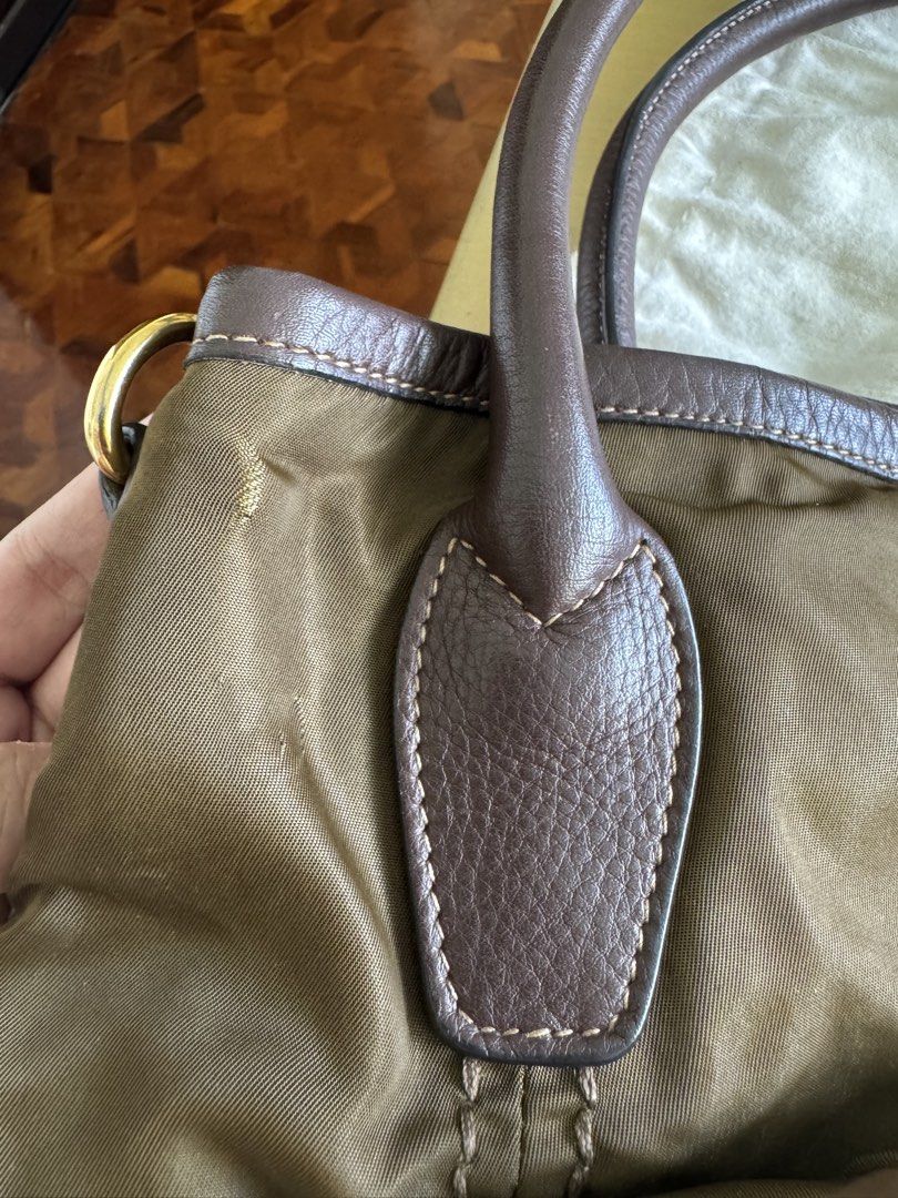 Prada Nylon Bag (Category: Luxury Bags & Wallets) located in Paranaque City. Submitted by starurot (Listing ID 1435549878, Image 3). Description: - Authentic Prada Vitello Daino Trimmed Tessuto Satchel BR 4420 - Brown color - Nylon body with leather trim - Detachable shoulder strap - Gold-tone hardware - Prada logo visible - Includes dust bag Used less than 10x Stored only Rfs: no need for this, decluttering MOP: BDO/ Gcash SF to be shouldered by