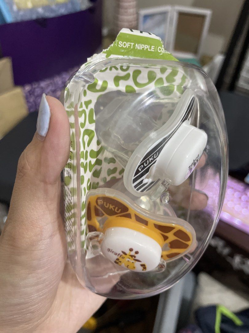 Puku Soft Nipple Pacifier Set (Buy 1 Take 1) (Category: Soothers & Pacifiers) located in Pasay City. Submitted by mamapeihan (Listing ID 1435659334, Image 2). Description: - Puku Pacifier Set from Taiwan - Includes two pacifiers - Animal designs: Zebra and Giraffe - Comes in a clear plastic case - Features soft nipples - SGS Approved - BPA Free.