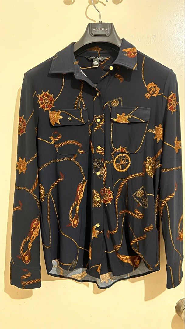 Ralph Lauren Nautical Print Shirt - Medium (Category: Longsleeves) located in Binan City. Submitted by sailingtrendshop (Listing ID 1435693933, Image 1). Description: - Navy blue shirt - Nautical print with gold chains and emblems - Size: Medium - Two front pockets - Button-down closure - Made in the Philippines.
