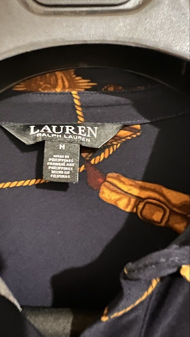 Ralph Lauren Nautical Print Shirt - Medium (Category: Longsleeves) located in Binan City. Submitted by sailingtrendshop (Listing ID 1435693933, Image 3). Description: - Navy blue shirt - Nautical print with gold chains and emblems - Size: Medium - Two front pockets - Button-down closure - Made in the Philippines.