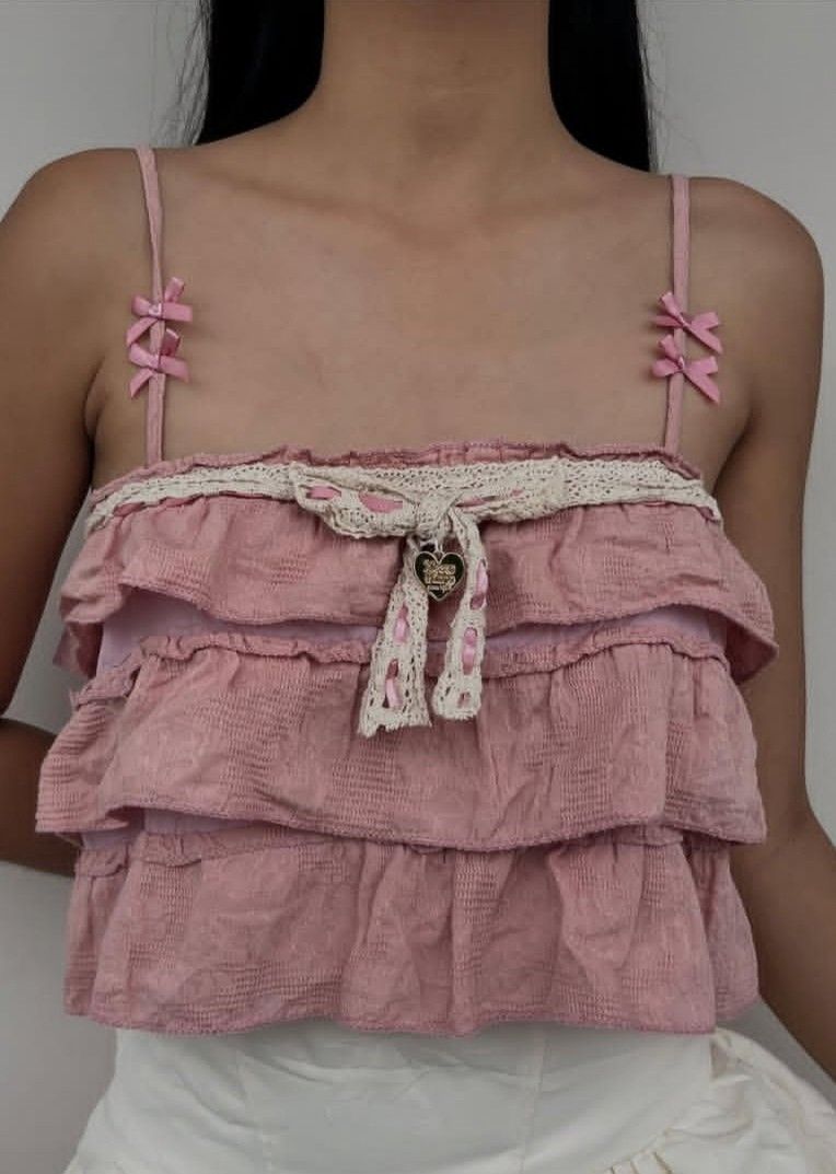 RARE Mezzo Piano Coquette Top (Category: Sleeveless) located in Odiongan. Submitted by fiercecrystal.5217c8 (Listing ID 1435689002, Image 1). Description: 🐰 SUPER RARE Mezzo Piano Coquette Top Selling my personal piece for emergency funds 😭 Market price ₱1.2k+ on IG, letting go cheap *Size*: XS-S | *Condition*: 9/10, no flaws, worn once for shoot only *Details*: Pink lace, ribbons, heart charm, ruffles. True loli/coquette aesthetic 💗 Steal pri