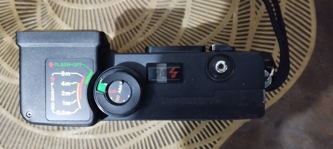 Ricoh Auto Half EF Film Camera (Category: Cameras) located in Manila. Submitted by ventajetoyz625 (Listing ID 1435671524, Image 3). Description: - Ricoh Auto Half EF film camera - Black body - Built-in flash with distance settings - Lens cover included - Comes with a strap - with power indicator only - As is condition, can be used for spare parts or for display - What you see is what you get.