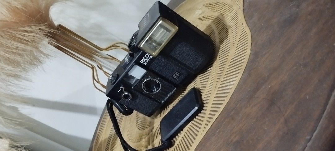 Ricoh Auto Half EF Film Camera (Category: Cameras) located in Manila. Submitted by ventajetoyz625 (Listing ID 1435671524, Image 2). Description: - Ricoh Auto Half EF film camera - Black body - Built-in flash with distance settings - Lens cover included - Comes with a strap - with power indicator only - As is condition, can be used for spare parts or for display - What you see is what you get.