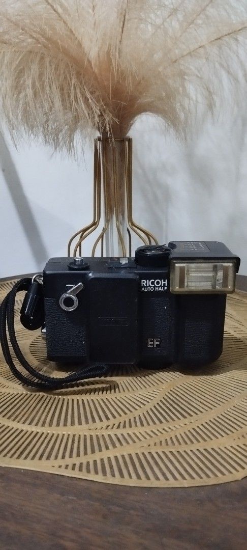Ricoh Auto Half EF Film Camera (Category: Cameras) located in Manila. Submitted by ventajetoyz625 (Listing ID 1435671524, Image 1). Description: - Ricoh Auto Half EF film camera - Black body - Built-in flash with distance settings - Lens cover included - Comes with a strap - with power indicator only - As is condition, can be used for spare parts or for display - What you see is what you get.