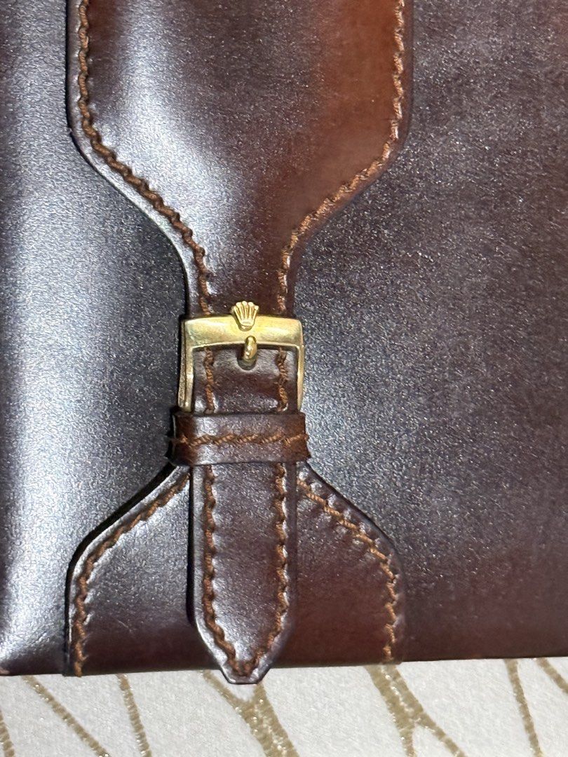 Rolex Leather Notebook (Category: Luxury Bags & Wallets) located in Pasay City. Submitted by alphaq21 (Listing ID 1435547932, Image 2). Description: Leather notebook from Rolex. It features a brown leather exterior with a buckle closure. The interior includes a notepad with the Rolex logo. The back of the notebook has the Rolex logo and the text "MONTRES ROLEX S.A. - GENEVE SUISSE - 71.06.04". Vintage Rolex Dealer’s Quote Leather Notepad Notebook