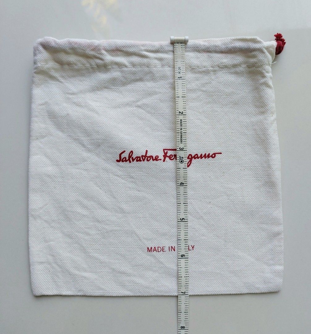 Salvatore Ferragamo Dust Bag (Category: Luxury Bags & Wallets) located in Lapu Lapu. Submitted by agnesapm_29813 (Listing ID 1435574567, Image 3). Description: - Authentic Salvatore Ferragamo dust bag - Made in Italy - Features the Salvatore Ferragamo logo in red - Measurements: 7 inches x 7 inches - Fabric: 100% cotone.