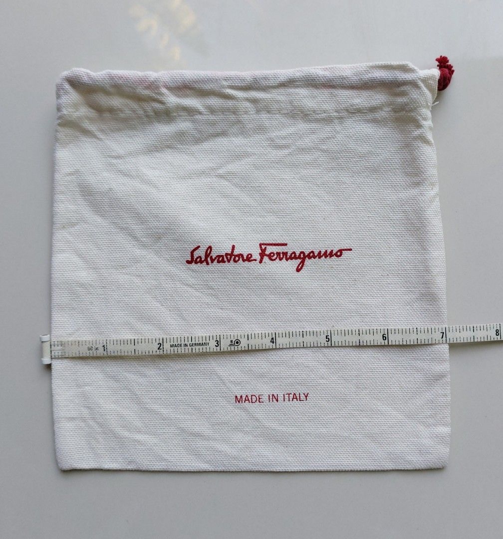 Salvatore Ferragamo Dust Bag (Category: Luxury Bags & Wallets) located in Lapu Lapu. Submitted by agnesapm_29813 (Listing ID 1435574567, Image 2). Description: - Authentic Salvatore Ferragamo dust bag - Made in Italy - Features the Salvatore Ferragamo logo in red - Measurements: 7 inches x 7 inches - Fabric: 100% cotone.