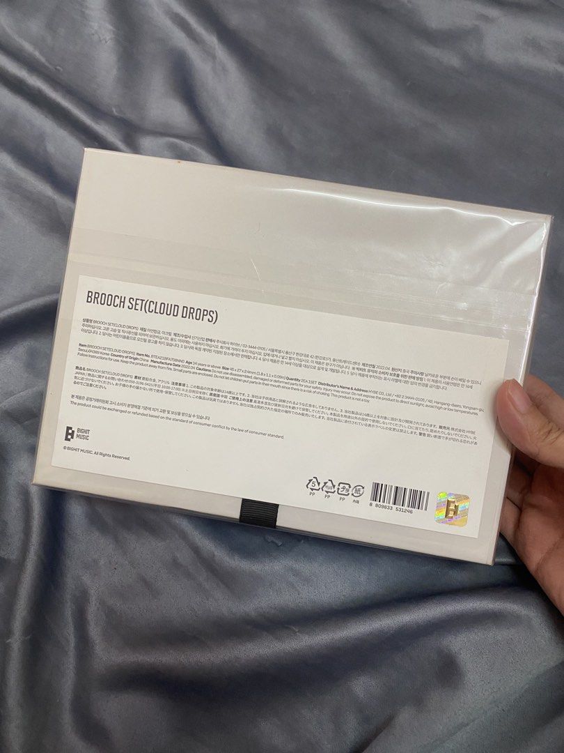 Sealed BTS V Artist-Made Collection Brooch Set (Cloud Drops) (Category: K-Wave Merchandise) located in Lucena. Submitted by totaldeclutter (Listing ID 1435525439, Image 2). Description: ₱1950 free SF for PAYO Artist-Made Collection by BTS V Brooch Set (Cloud Drops). The set is still sealed in its original packaging. The back of the box includes details such as the size of the brooch and the manufacturer's information. The set includes a brooch an